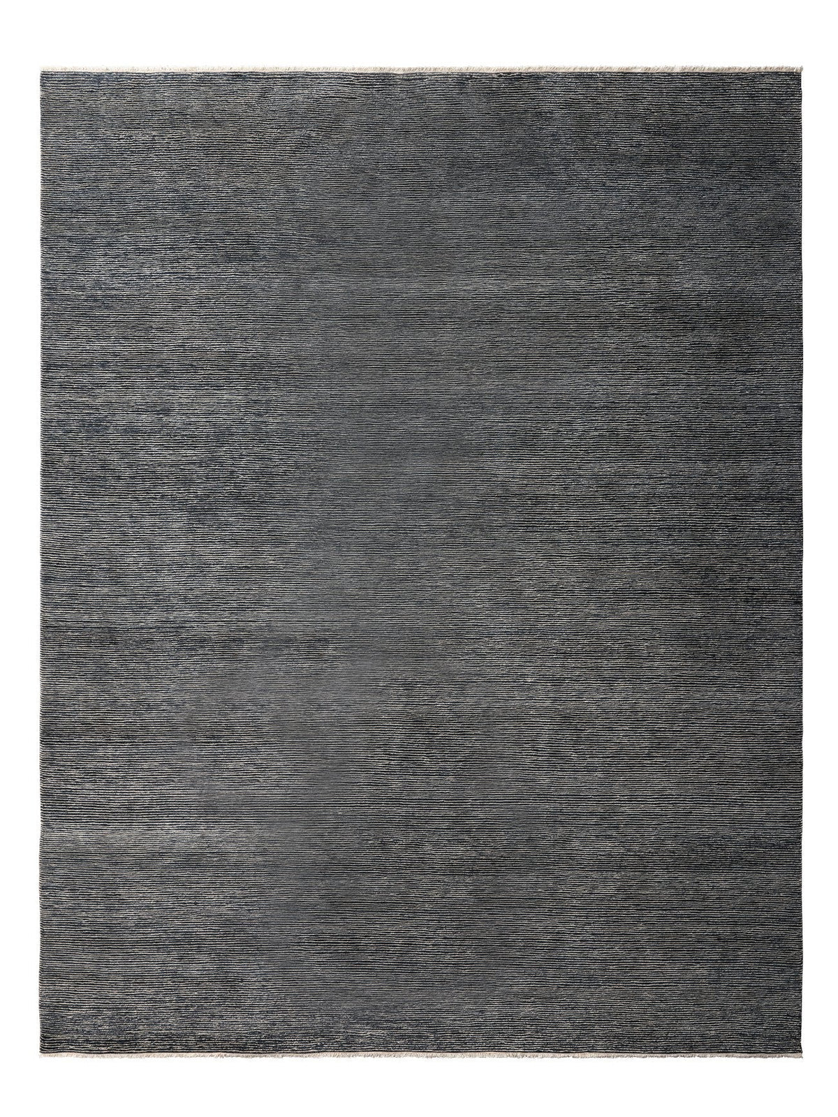 Armadillo Corsica Rug in Indigo, overhead view of the handwoven wool and linen weave and edge finish
