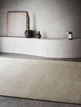 Armadillo Corsica Rug in Saltbush, handwoven wool and linen rug shown in a room setting