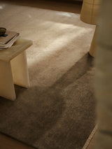 Armadillo Corsica Rug in Flannel, a second view of the handwoven wool and linen rug in a styled interior