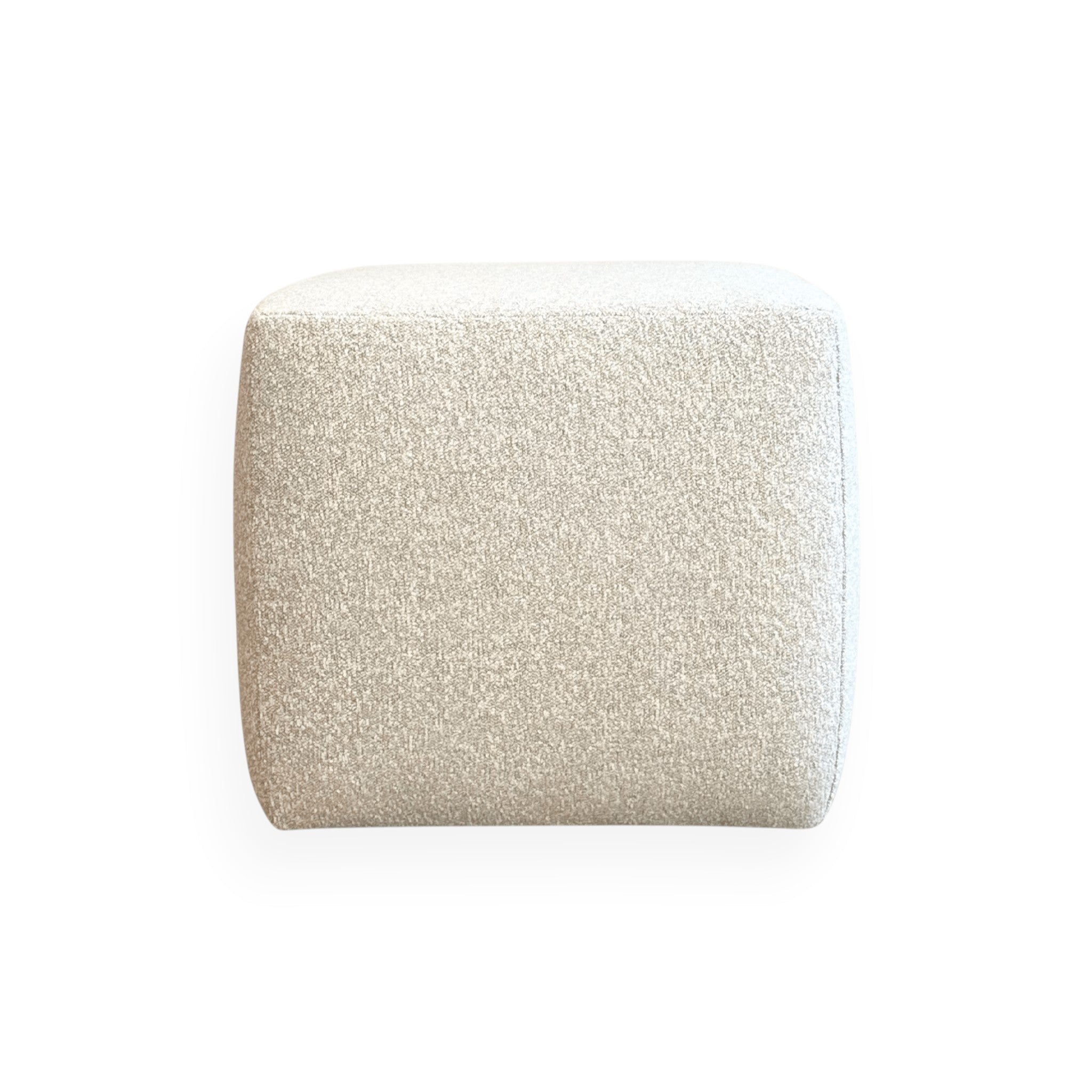Calimia Home Cube Ottoman upholstered in nubby oatmeal Belgian linen with a minimalist square silhouette.