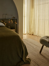 Armadillo Selva Rug in Oat, a second view of the handwoven afghan wool kilim rug in a styled interior