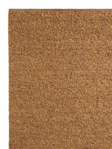 Armadillo Mason Rug in Yolk, corner close-up of the new zealand wool pile and edge