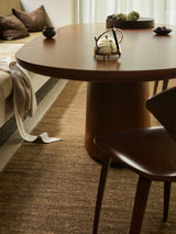 Armadillo Latitude Rug in Caramel, a second view of the handwoven linen flatweave rug in a styled interior