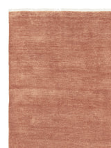 Armadillo Agra Rug in Salmon, corner close-up of the wool pile and edge