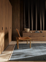 Armadillo Cable Rug in Chambray, handwoven soumak wool rug shown in a room setting