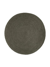 Armadillo Braid Rug in Ivy, overhead view of the hand-braided wool blend weave and edge finish