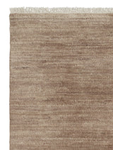 Armadillo Odessa Rug in Banksia, corner close-up of the afghan wool pile and edge
