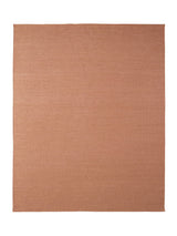 Armadillo Aerie Rug in Bellini, a second view of the handwoven flatweave rug in a styled interior
