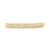 Close-up of Delicate Stack bracelet in yellow gold showing delicate spheres