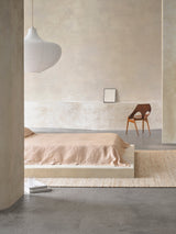 Armadillo Drift Rug in Natural & White, handwoven jute and wool rug shown in a room setting