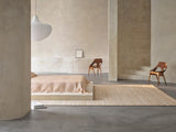 Armadillo Drift Rug in Natural & White, overhead view of the handwoven jute and wool weave and edge finish