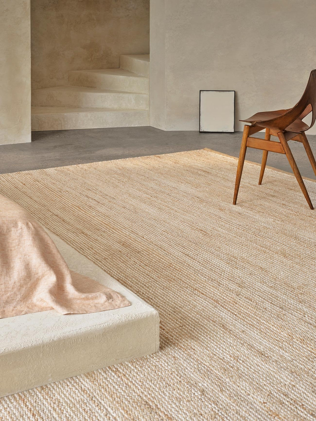 Drift Rug by Armadillo, handwoven jute and wool rug, styled in a room at Calimia Home