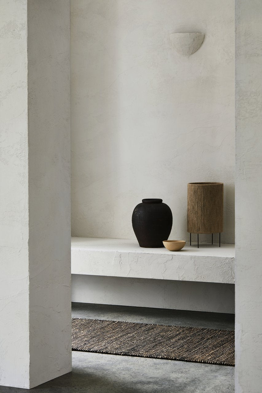 Armadillo Drift Runner in Natural & Black, handwoven jute and wool rug shown in a room setting