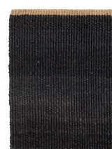 Armadillo Nest Nook Rug in Charcoal, corner close-up of the jute pile and edge