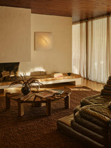 Armadillo Arroyo Rug in Tamarind, handwoven felted wool rug shown in a room setting