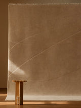 Armadillo Marea Rug in Vellum, hand-knotted and hand-carved wool rug shown in a room setting