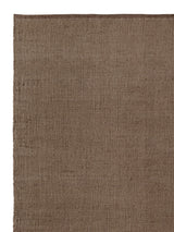 Armadillo Palloza Rug in Shale, corner close-up of the jute (rattan adds a touch of undyed wool) pile and edge