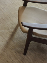 Armadillo Odessa Rug in Travertine, a second view of the hand-knotted afghan wool rug in a styled interior