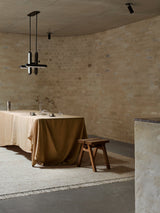 Armadillo Willow Rug in Eggshell, handwoven flatweave rug shown in a room setting