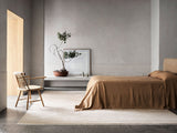 Armadillo Eden Rug in Nougat, a second view of the hand-knotted wool rug in a styled interior