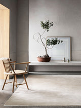 Armadillo Eden Rug in Nougat, hand-knotted wool rug shown in a room setting