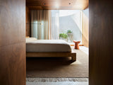 Armadillo Willow Rug in Cumin, a second view of the handwoven flatweave rug in a styled interior