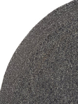 Armadillo Braid Rug in Charcoal, corner close-up of the wool and viscose blend pile and edge