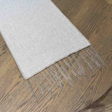 Elise Taupe Table Runner detail — close-up of delicate wool embroidery on soft Belgian linen
