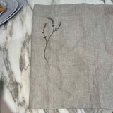 Willow Stitch Apron by One Bi One — embroidered Belgian linen in oatmeal, adjustable ties, handcrafted in Gothenburg, Sweden