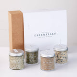 Set of spice jars with a branded box on a white background