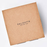 Calicutts Essentials Gift Set in a square brown cardboard box with Calicutts Spice Co. branding