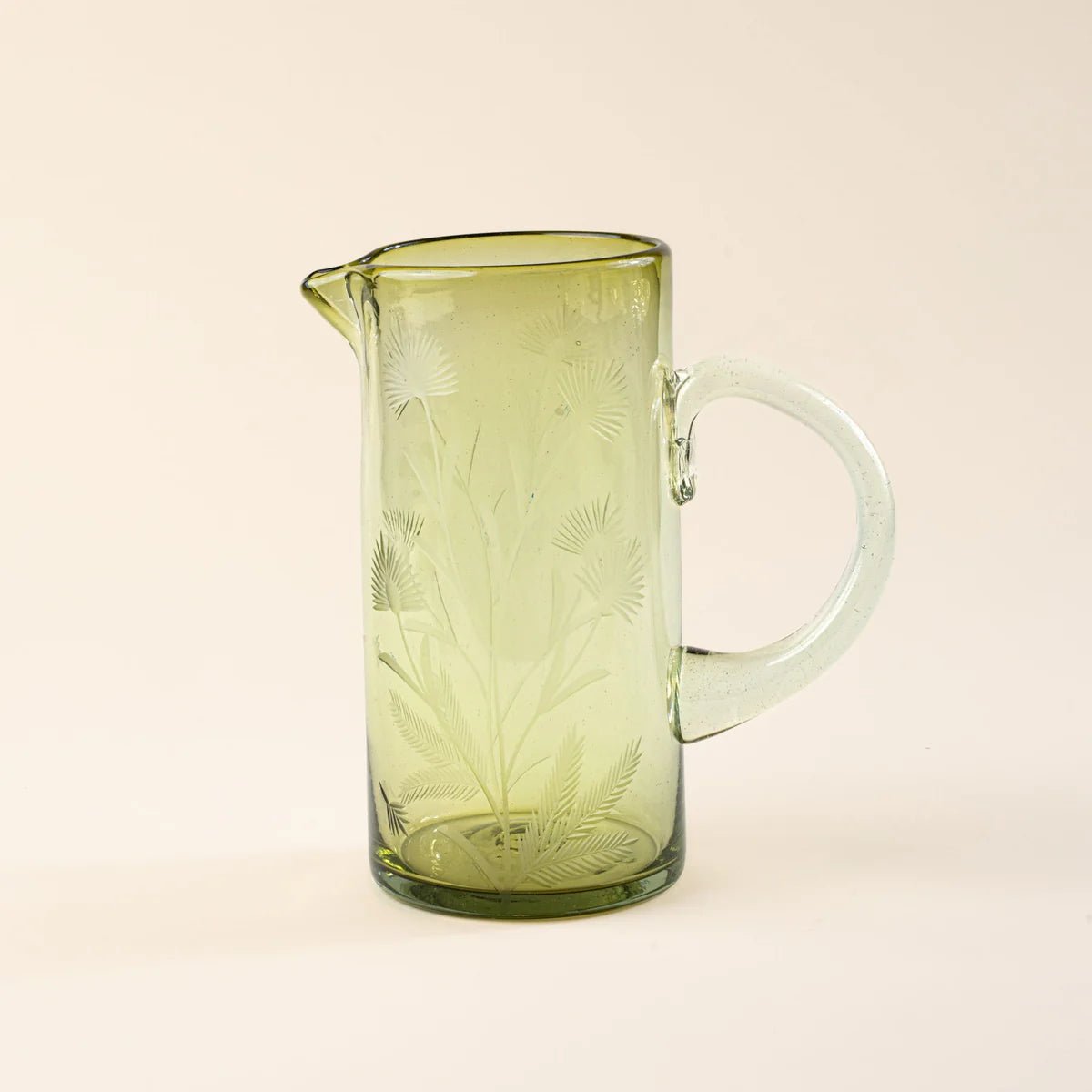 Etched Thistle Pitcher showing natural glass color variations