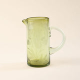 Etched Thistle Pitcher showing natural glass color variations