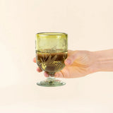 Olive wine glass shown from the side, displaying the soft curves