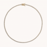 Yellow gold tennis necklace worn on neck