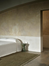 Armadillo Mojave Rug in Laurel, a second view of the hand-knotted jute rug in a styled interior