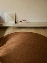 Armadillo Braid Rug in Persimmon, detail of the wool and viscose blend weave and texture