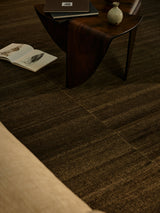 Armadillo Selva Rug in Walnut, a second view of the handwoven afghan wool kilim rug in a styled interior