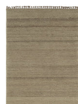 Armadillo Selva Rug in Silt, corner close-up of the afghan wool pile and edge