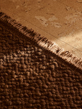 Armadillo Arroyo Rug in Tamarind, overhead view of the handwoven felted wool weave and edge finish