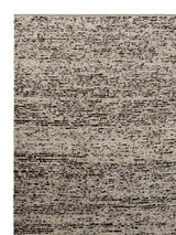Armadillo Faroe Rug in Muscovado, corner close-up of the undyed european wool pile and edge