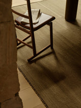 Armadillo Selva Rug in Silt, overhead view of the handwoven afghan wool kilim weave and edge finish