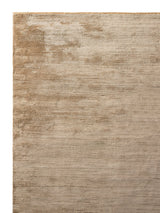 Armadillo Staccato Rug in Latte, corner close-up of the silk, linen, and cotton pile and edge