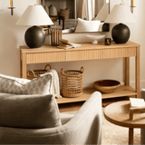 Pieter Desk in white oak with fluted drawers, black ceramic lamps and linen swivel chairs at Calimia Home