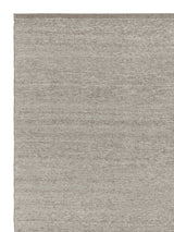 Armadillo Field Rug in Brindle, corner close-up of the rws-certified undyed european wool pile and edge