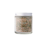 Calicutts Fish Spice Blend in a glass jar with a silver lid, featuring herbal and citrus seasoning for seafood.