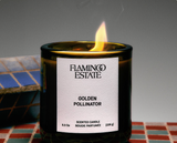 Flamingo Estate Golden Pollinator Candle label close-up on a tiled surface