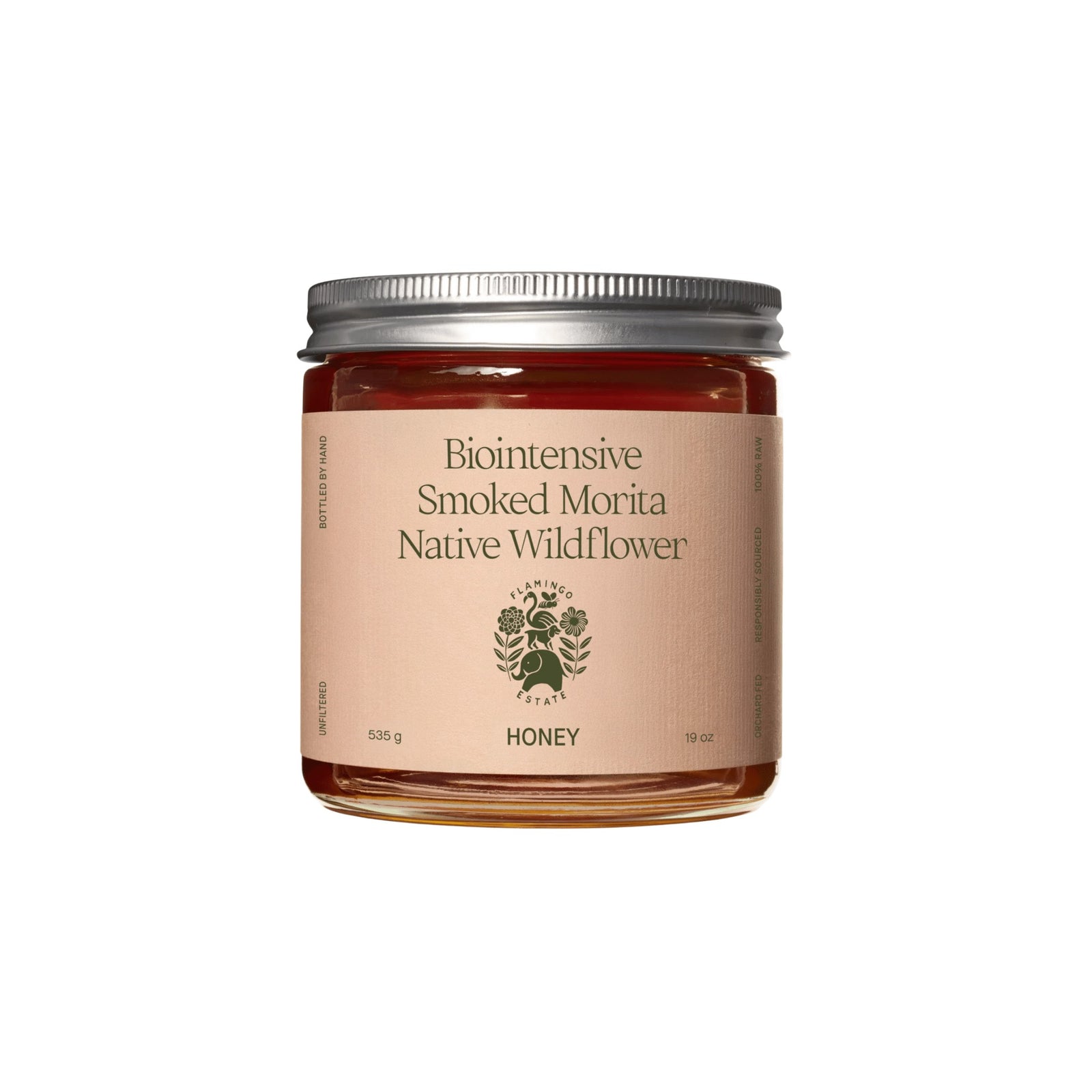 A clear Flamingo Estate Smoked Morita Native Wildflower Honey jar, 535 g, 19 oz, with a silver lid and deep red-amber honey, on white.