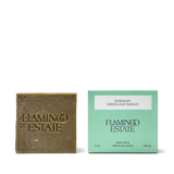 Flamingo Estate Rosemary & Parsley Soap Brick beside its mint-green 12 oz carton labeled Rosemary Green Leaf Parsley.