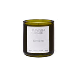 Flamingo Estate Sappho Fig scented candle in a dark green glass jar with a white minimalist label